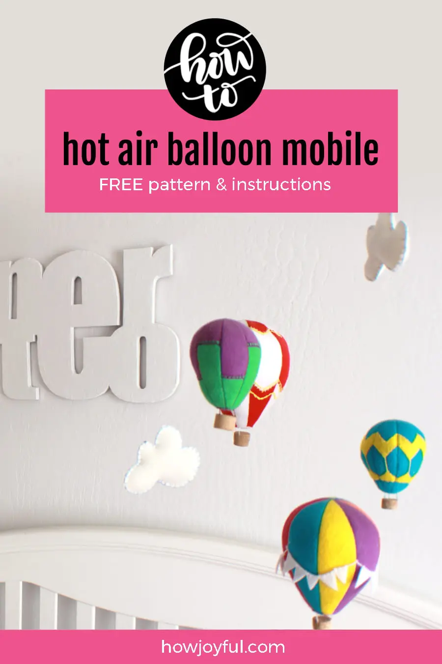 Hot air balloon over white crib